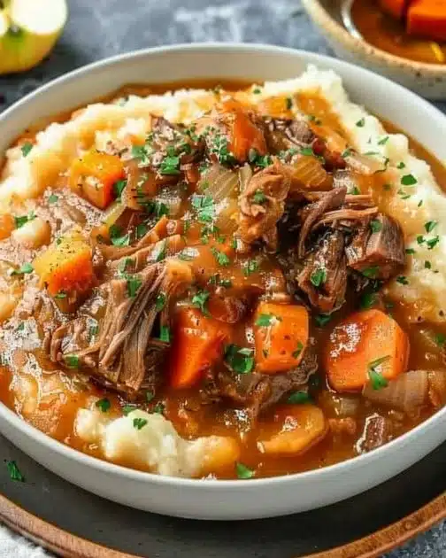 Bowl of delicious apple cider stew mash with fresh ingredients