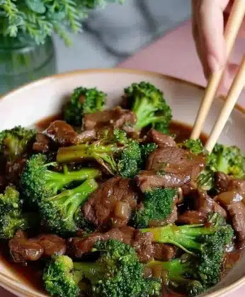 Beef and broccoli stir-fry dish served with rice in a bowl