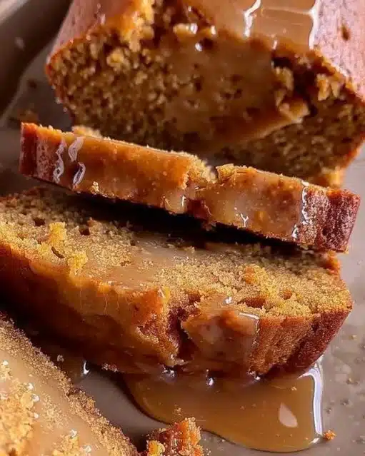 Slice of brown butter pumpkin bread topped with salted maple glaze