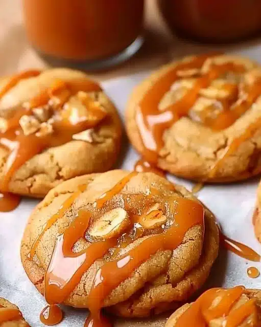 Delicious homemade caramel apple cookies with apples and caramel drizzle