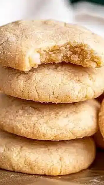 Freshly baked chewy sugar cookies on a cooling rack