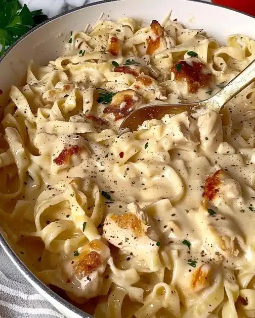 Dairy-free chicken alfredo with gluten-free farfalle in a bowl