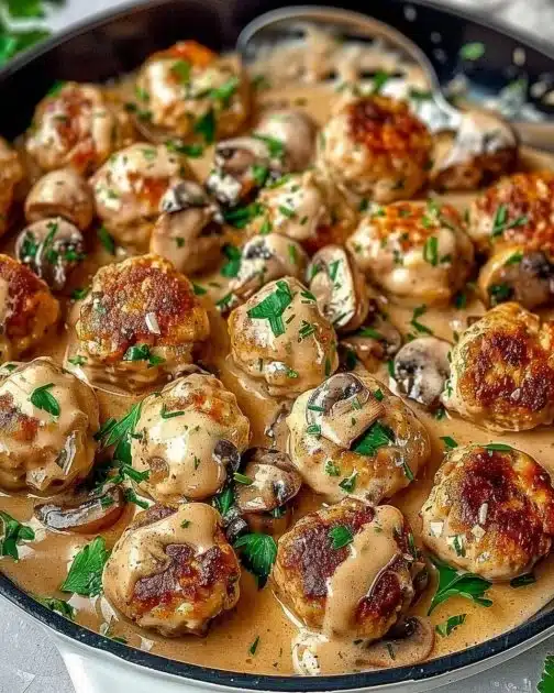 Plate of creamy mushroom chicken meatballs served with sauce