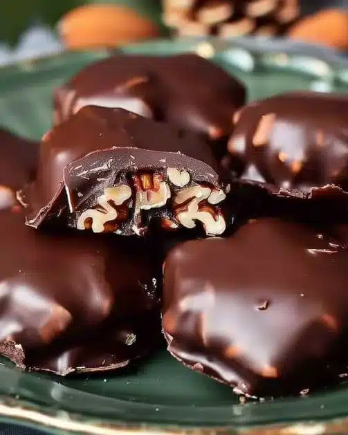 Delicious homemade Christmas Pecan Turtles on a festive tray.