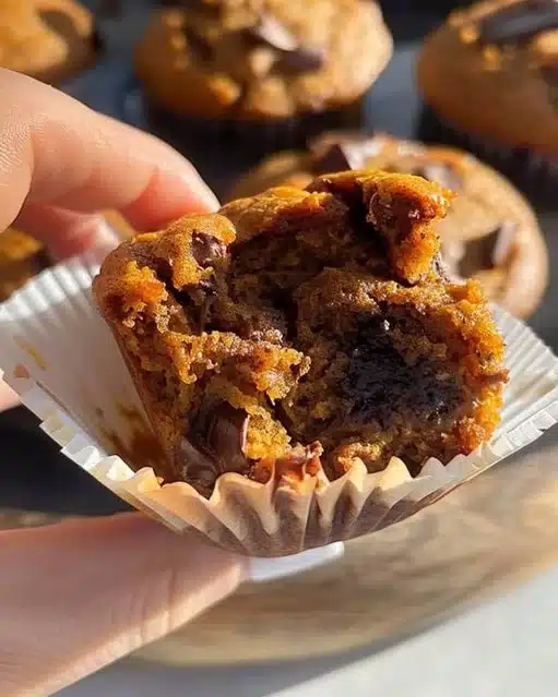 Freshly baked gluten free pumpkin muffins with spices and pumpkin puree.