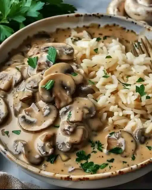 Delicious Mushroom Stroganoff served in a bowl with herbs