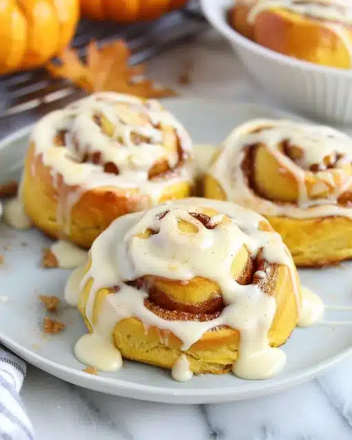 Delicious pumpkin cinnamon rolls with brown butter cream cheese frosting