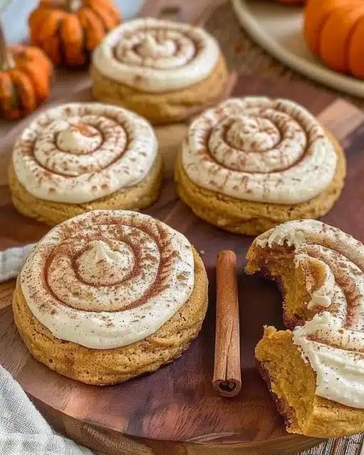 Soft pumpkin cookies with cinnamon frosting on a plate