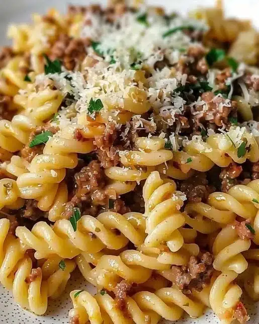 Creamy garlic parmesan pasta with ground beef served in a bowl