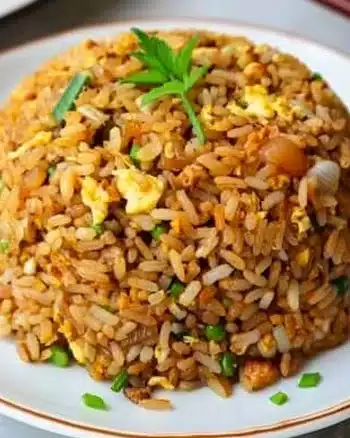 Delicious easy 10-minute fried rice served in a bowl with vegetables and eggs.