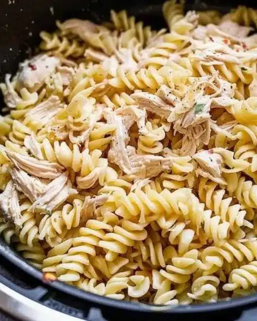 Creamy Garlic Parmesan Chicken Pasta garnished with herbs