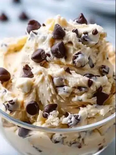 Bowl of Greek yogurt cookie dough with chocolate chips and spoon