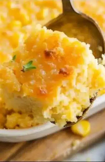Delicious Jiffy Corn Pudding served in a bowl, showcasing its creamy texture.