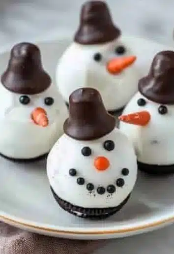 Delicious Snowman Oreo Balls decorated for the holidays