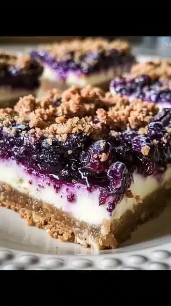 Blueberry crisp cheesecake bars with a delicious crumbly topping