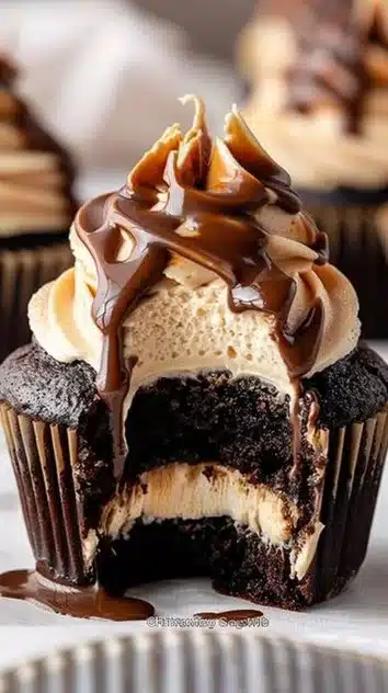Chocolate cupcakes filled with coffee cream and topped with espresso buttercream and ganache