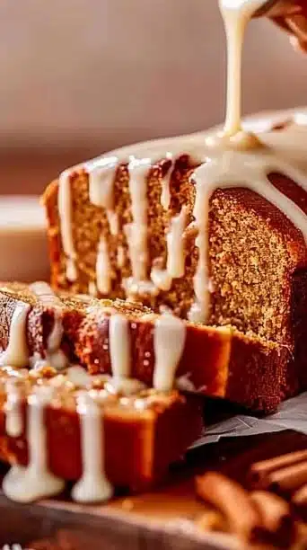 Homemade Gingerbread Eggnog Loaf garnished with spices and holiday decorations