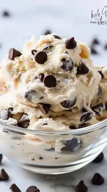 A bowl of Greek Yogurt Cookie Dough with chocolate chips and nuts, a healthy snack option.