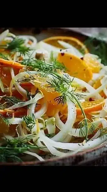 Shaved fennel and orange salad with fresh herbs and festive presentation