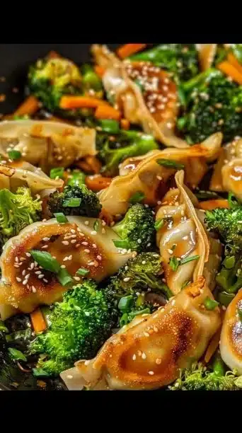 Beef potstickers in a vibrant stir fry with vegetables.
