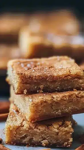 Delicious chewy snickerdoodle cookie bars sprinkled with cinnamon sugar