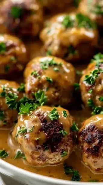 Delicious Crockpot Swedish Meatballs in Cream Sauce served in a bowl