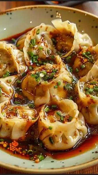 One pan dumpling dinner with colorful vegetables and dipping sauce