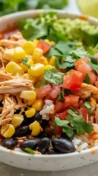 Slow Cooker Chicken Burrito Bowls with seasoned chicken and toppings